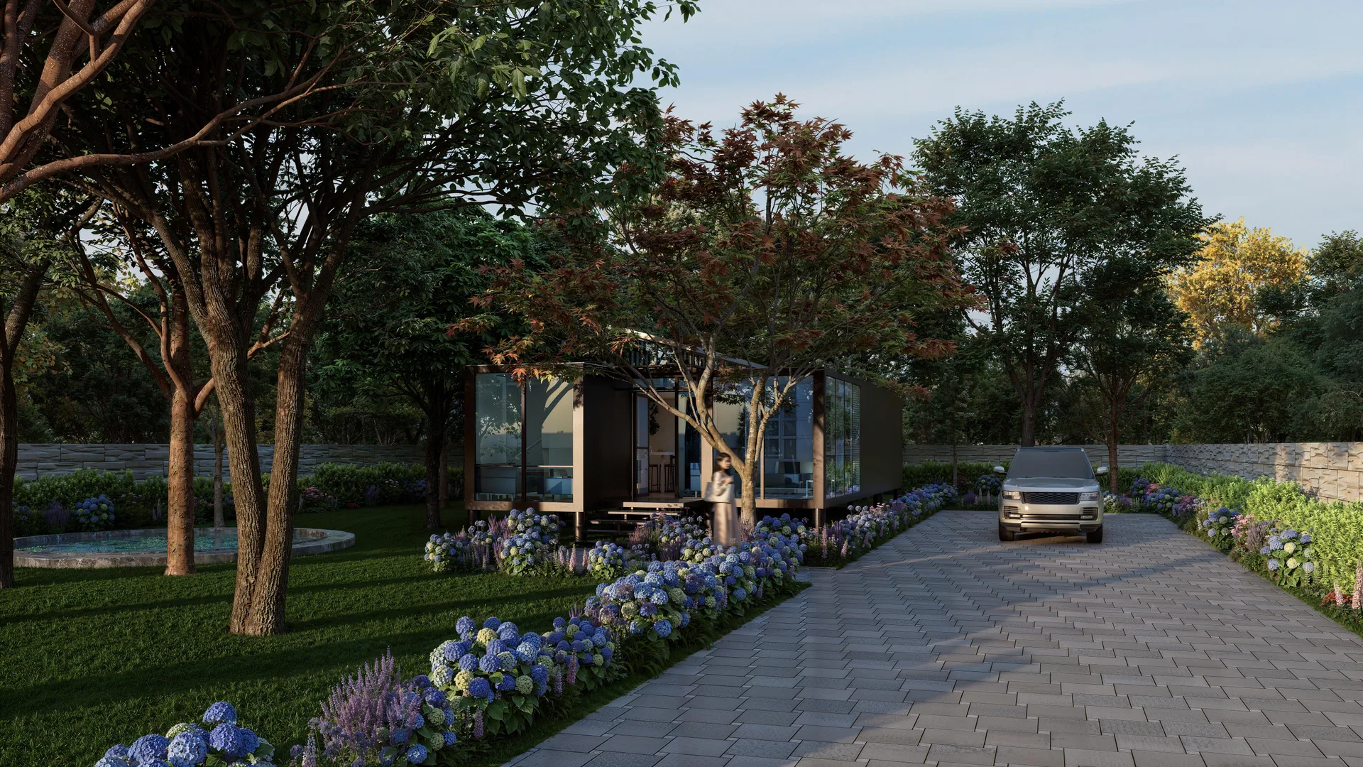 Container House: vista esterna della container house dal vialetto, con le vetrate a tutt'altezza e il giardino